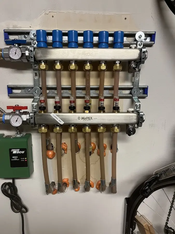 Plumber performing Water Heater Repair at a residential property in Grosse Pointe Farms